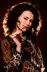 Obraz premium Portrait of beautiful young woman in glasses