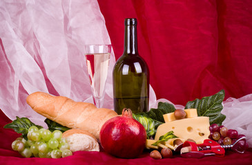 wine, grape, cheese, pomegranate and long loaf