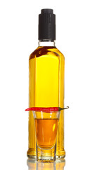 bottle and glass of pepper vodka and red chili pepper isolated