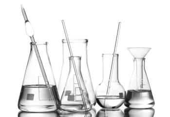 Different laboratory glassware with water and empty with