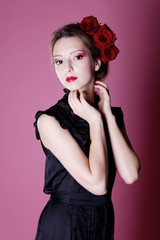 Beautiful girl with rose in hair