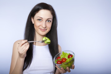 portrait of attractive  smiling woman eating salat