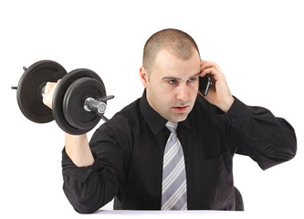 Adult business man on the phone doing fitness at work