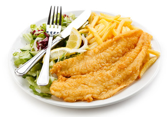 Fish dish - fried fish fillet, French fries with vegetables