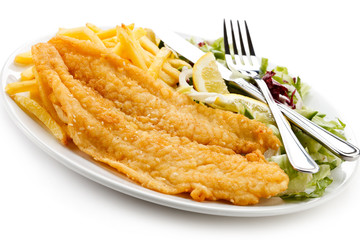 Fish dish - fried fish fillet, French fries with vegetables