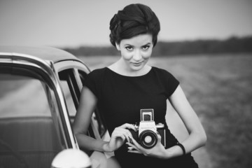beatuful woaman and a retro car