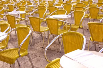 Empty chairs on a terrace in summer