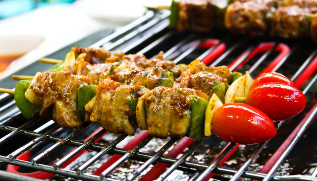 Sizzling barbecue sticks with meat and vegetables
