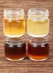 Four jars full of honey, mix taste