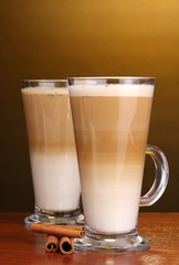 Fragrant сoffee latte in glass cups and cinnamon