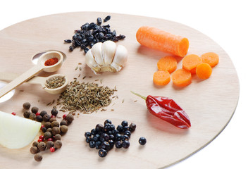 spices on a wooden palette isolated on white