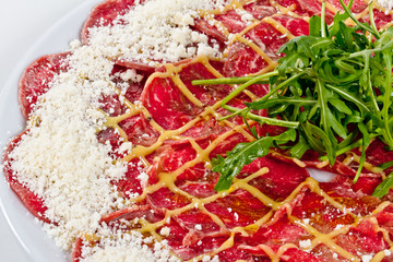 Meat (beef) Carpaccio with Parmesan Cheese and ruccola