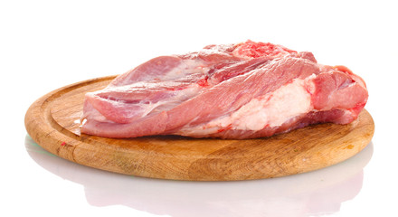 Raw meat on a wooden board isolated on white
