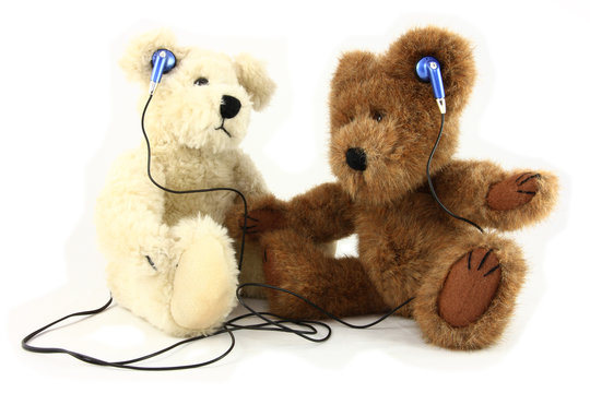Two Teddy Bears Sharing Music With Headphones