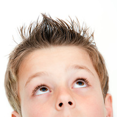 Extreme close up of boy looking up.