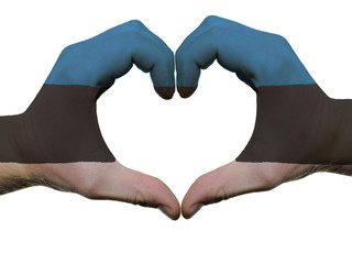 Heart and love gesture in estonia flag colors by hands isolated