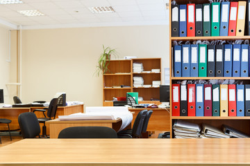 Modern office interior with tables, chairs and bookcases  Nobody