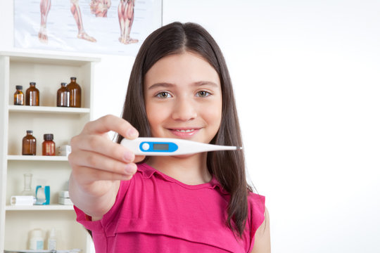 Girl Showing Thermometer in Clinic