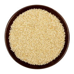 Sesame seeds in brown plate
