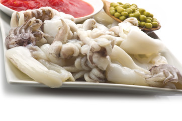 fresh cuttlefish with peas and sauce.