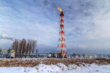 Chimneys of Polish oil rafinery in Gdansk at frosty winter