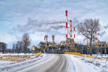Chimneys of Polish oil rafinery in Gdansk at frosty winter