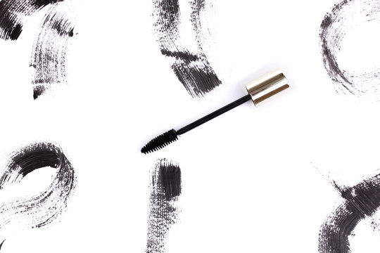 Black mascara brush strokes isolated on white