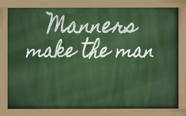 expression -  Manners make the man - written on a school blackbo