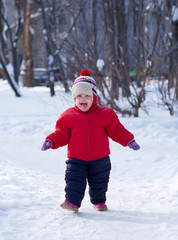 Fototapeta na wymiar happy toddler in winter park