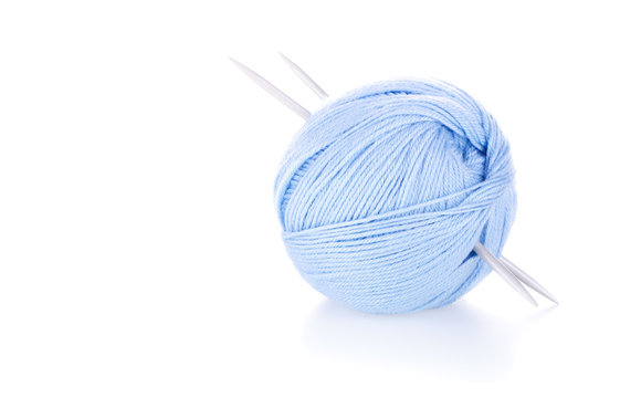 Blue Ball Of Woollen Yarn With Needles On White Background.