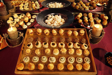 Colorful desserts and pastry served on a wedding party
