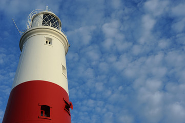 Winter sunlight hits Portland Bill Lighthouse, Dorset, England