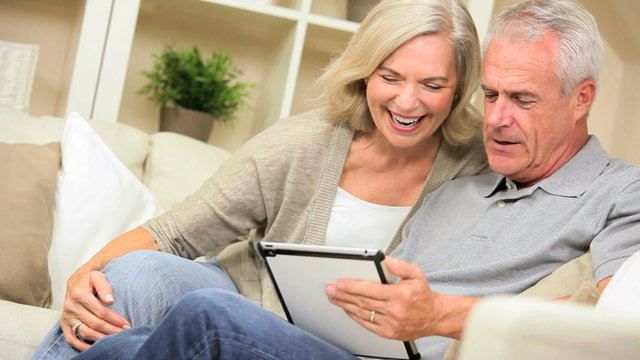 Senior Couple Having Fun with a Wireless Tablet