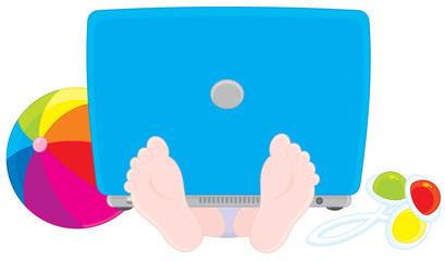 Child with a laptop, ball and rattle