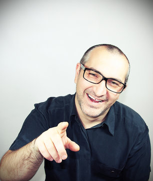 portrait of a man with glasses smiling