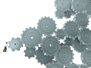 Businessman Turning a Gear