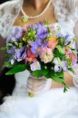 Bride holding beautiful wedding flowers bouquet