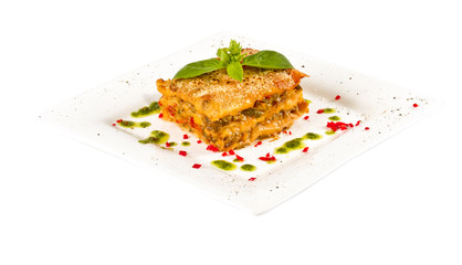 Closeup of lasagna and basil fork