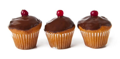 Three cupcakes with chocolate frosting