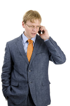 Attractive young businessman speking over the phone