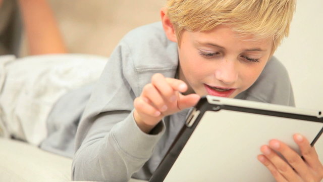 Little Boy Using Wireless Tablet