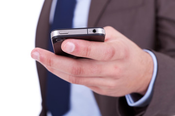 Flat cell phone in businessman hand