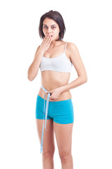 Young slim woman measuring