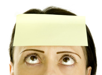 woman with blank note paper on her head