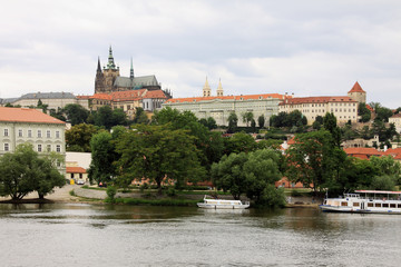 Obraz premium View on the spring Prague gothic Castle above River Vltava