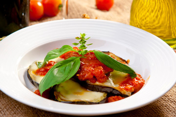 Grilled eggplant with tomato, mozzarella and basil.