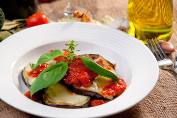 Grilled eggplant with tomato, mozzarella and basil.