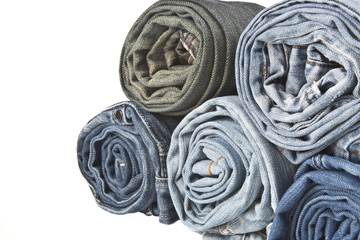 Fototapeta na wymiar roll denim jeans arranged in stack