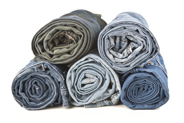 roll  denim jeans arranged in stack