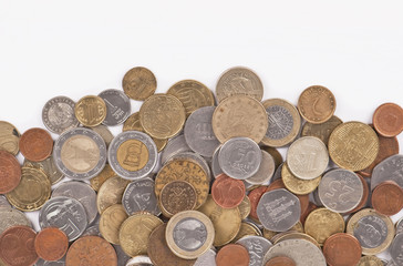 Background with different coins close-up on white background © Irina Ukrainets